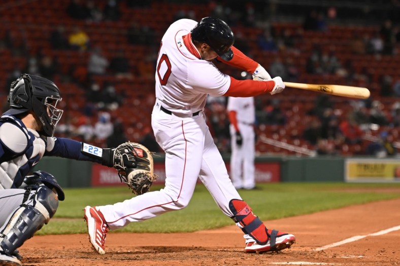 Apr 22, 2021; Boston, Massachusetts, USA; Boston Red Sox right fielder Hunter Renfroe (10) hits a RBI single against the Seattle Mariners during the fourth inning at Fenway Park. Mandatory Credit: Brian Fluharty-USA TODAY Sports