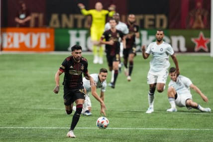 Apr 24, 2021; Atlanta, Georgia, USA; Atlanta United midfielder Marcelino Moreno (10) runs after the ball against the Chicago Fire during the first half at Mercedes-Benz Stadium. Mandatory Credit: Dale Zanine-USA TODAY Sports