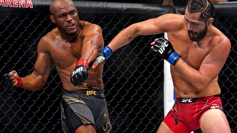 Apr 24, 2021; Jacksonville, Florida, USA; Kamaru Usman (Red Gloves) fights Jorge Masvidal (Blue Gloves) during UFC 261 at VyStar Veterans Memorial Arena. Mandatory Credit: Jasen Vinlove-USA TODAY Sports