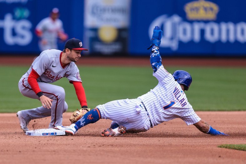 Apr 25, 2021; New York City, New York, USA; Washington Nationals shortstop Trea Turner (7) tags New York Mets second baseman Jonathan Villar (1) for an out after being picked off at first base during the second inning inning at Citi Field. Mandatory Credit: Vincent Carchietta-USA TODAY Sports