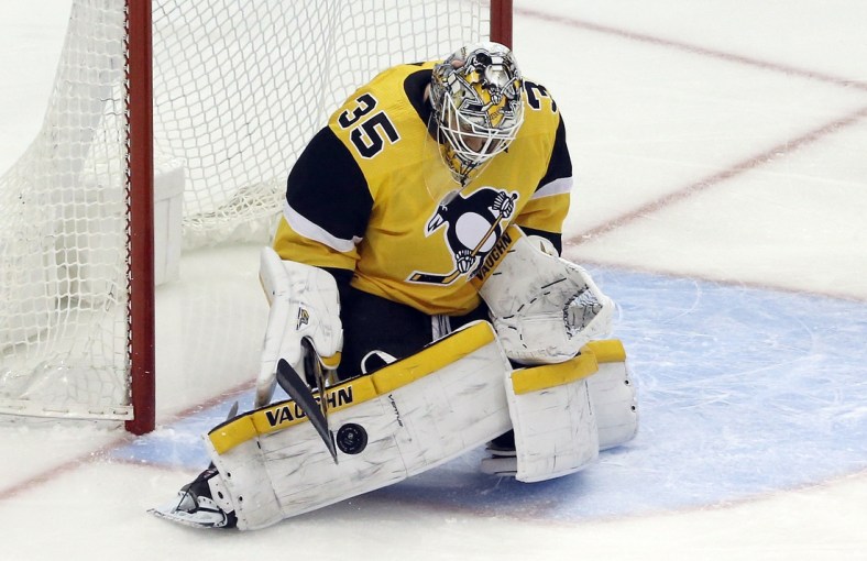 Apr 25, 2021; Pittsburgh, Pennsylvania, USA; Pittsburgh Penguins goaltender Tristan Jarry (35) makes a save against the Boston Bruins during the first period at PPG Paints Arena. Mandatory Credit: Charles LeClaire-USA TODAY Sports