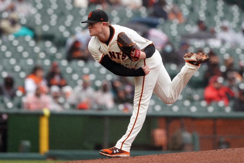 Apr 25, 2021; San Francisco, California, USA; San Francisco Giants starting pitcher Logan Webb (62) throws a pitch during the first inning against the Miami Marlins at Oracle Park. Mandatory Credit: Darren Yamashita-USA TODAY Sports