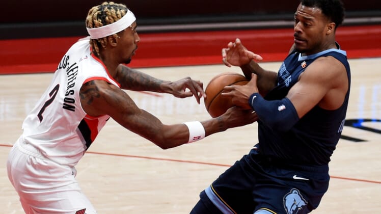 Apr 25, 2021; Portland, Oregon, USA; Portland Trail Blazers forward Rondae Hollis-Jefferson (2) pokes the ball away from Memphis Grizzlies center Xavier Tillman (2) during the first half of the game at Moda Center. Mandatory Credit: Steve Dykes-USA TODAY Sports