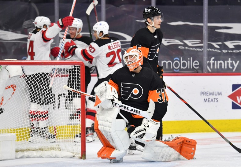 Apr 25, 2021; Philadelphia, Pennsylvania, USA; Philadelphia Flyers goaltender Brian Elliott (37) reacts after allowing a goal by New Jersey Devils left wing Miles Wood (44) during the second period at Wells Fargo Center. Mandatory Credit: Eric Hartline-USA TODAY Sports