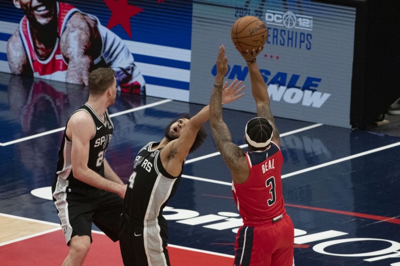Apr 26, 2021; Washington, District of Columbia, USA;  Washington Wizards guard Bradley Beal (3) shoots over San Antonio Spurs guard Derrick White (4) during the first half at Capital One Arena. Mandatory Credit: Tommy Gilligan-USA TODAY Sports