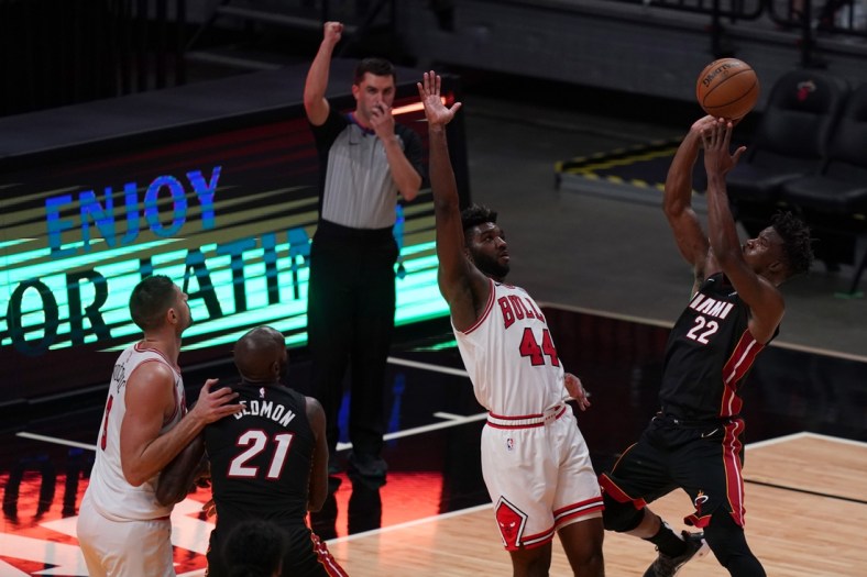 Apr 26, 2021; Miami, Florida, USA; Chicago Bulls forward Patrick Williams (44) fouls Miami Heat forward Jimmy Butler (22) on the shot during the second half at American Airlines Arena. Mandatory Credit: Jasen Vinlove-USA TODAY Sports