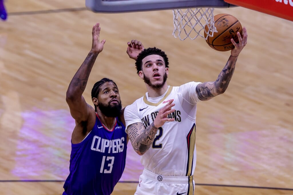 Apr 26, 2021; New Orleans, Louisiana, USA;  New Orleans Pelicans guard Lonzo Ball (2) drives to the basket against LA Clippers guard Paul George (13) during the second half at the Smoothie King Center. Mandatory Credit: Stephen Lew-USA TODAY Sports