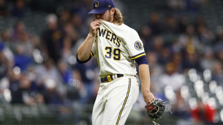 Apr 26, 2021; Milwaukee, Wisconsin, USA; Milwaukee Brewers pitcher Corbin Burnes (39) wipes his face after being removed from the game during the sixth inning against the Miami Marlins at American Family Field. Mandatory Credit: Jeff Hanisch-USA TODAY Sports
