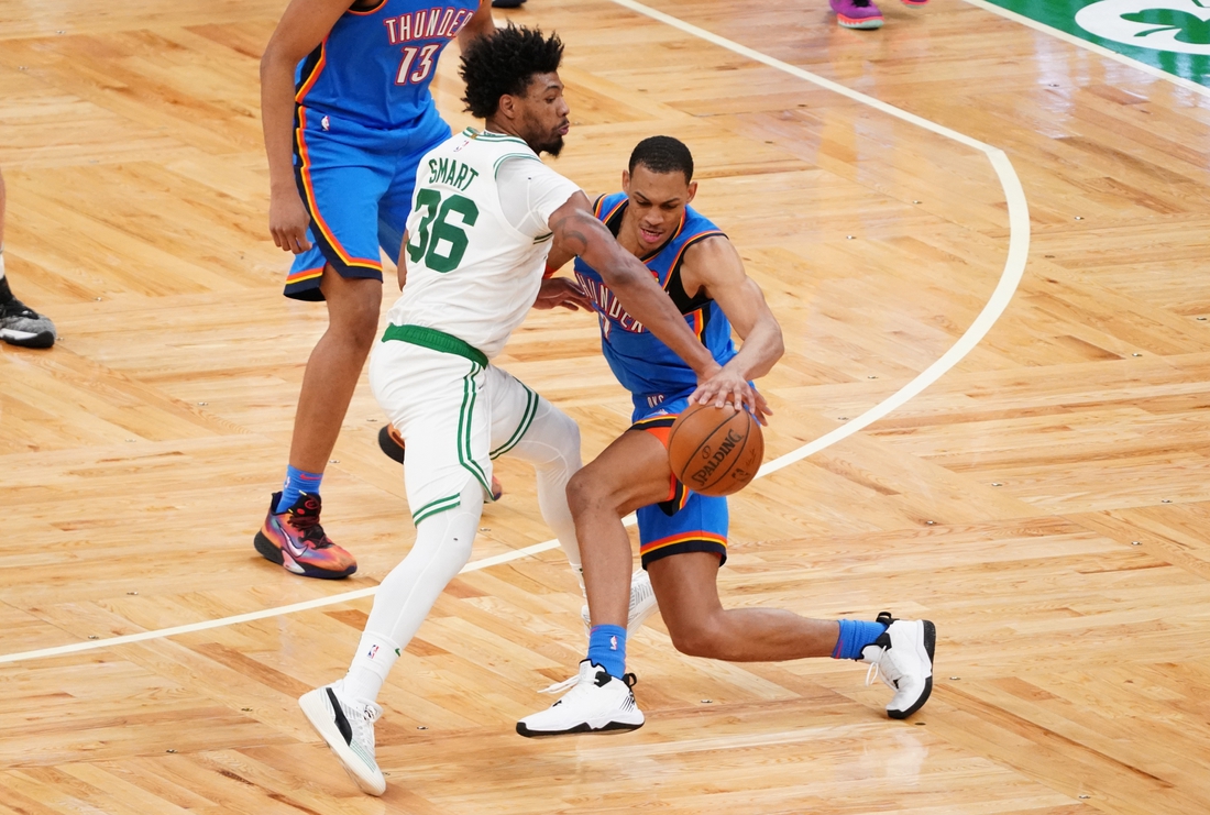 Apr 27, 2021; Boston, Massachusetts, USA; Boston Celtics guard Marcus Smart (36) strips the ball from Oklahoma City Thunder forward Darius Bazley (7) in the third quarter at TD Garden. Mandatory Credit: David Butler II-USA TODAY Sports