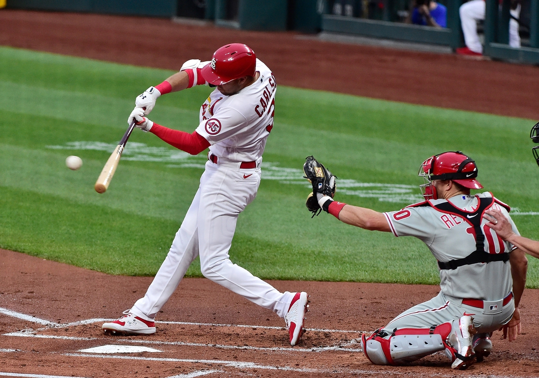 Apr 27, 2021; St. Louis, Missouri, USA;  St. Louis Cardinals center fielder Dylan Carlson (3) hits a double during the first inning against the Philadelphia Phillies at Busch Stadium. Mandatory Credit: Jeff Curry-USA TODAY Sports