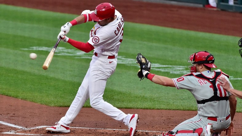 Apr 27, 2021; St. Louis, Missouri, USA;  St. Louis Cardinals center fielder Dylan Carlson (3) hits a double during the first inning against the Philadelphia Phillies at Busch Stadium. Mandatory Credit: Jeff Curry-USA TODAY Sports