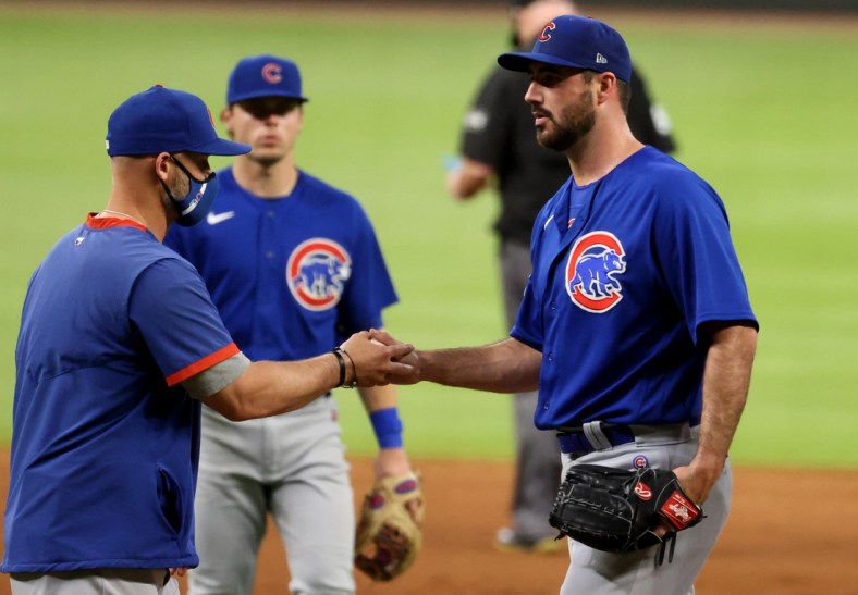 Apr 27, 2021; Atlanta, Georgia, USA; Chicago Cubs manager David Ross, left, removes Chicago Cubs relief pitcher Brandon Workman from the mound during the eighth inning against the Atlanta Braves at Truist Park. Mandatory Credit: Jason Getz-USA TODAY Sports