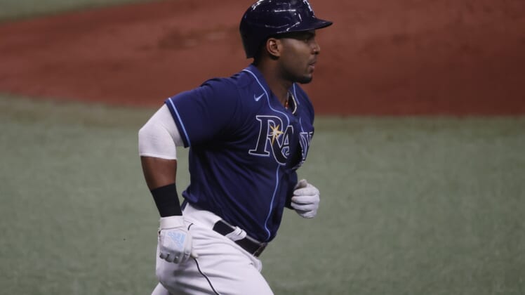 Apr 28, 2021; St. Petersburg, Florida, USA; Tampa Bay Rays first baseman Yandy Diaz (2) singles during the second inning against the Oakland Athletics  at Tropicana Field. Mandatory Credit: Kim Klement-USA TODAY Sports