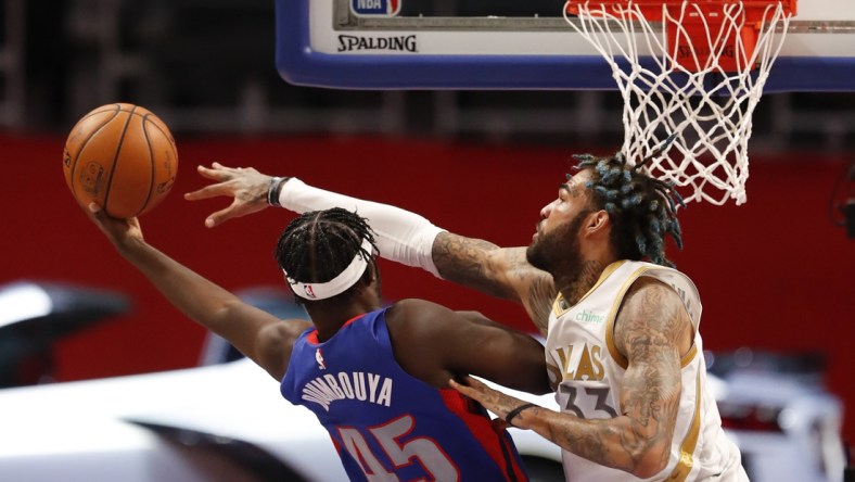 Apr 29, 2021; Detroit, Michigan, USA; Detroit Pistons forward Sekou Doumbouya (45) gets fouled by Dallas Mavericks center Willie Cauley-Stein (33) during the second quarter at Little Caesars Arena. Mandatory Credit: Raj Mehta-USA TODAY Sports