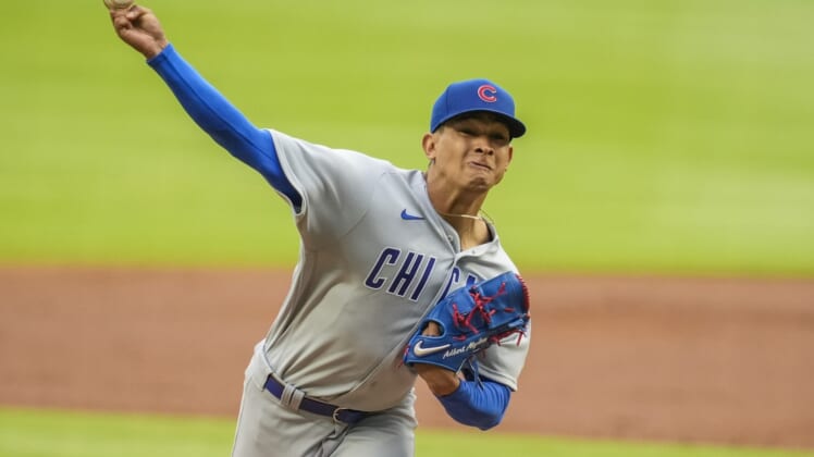 Apr 29, 2021; Cumberland, Georgia, USA; Chicago Cubs starting pitcher Adbert Alzolay (73) pitches against the Atlanta Braves during the first inning at Truist Park. Mandatory Credit: Dale Zanine-USA TODAY Sports