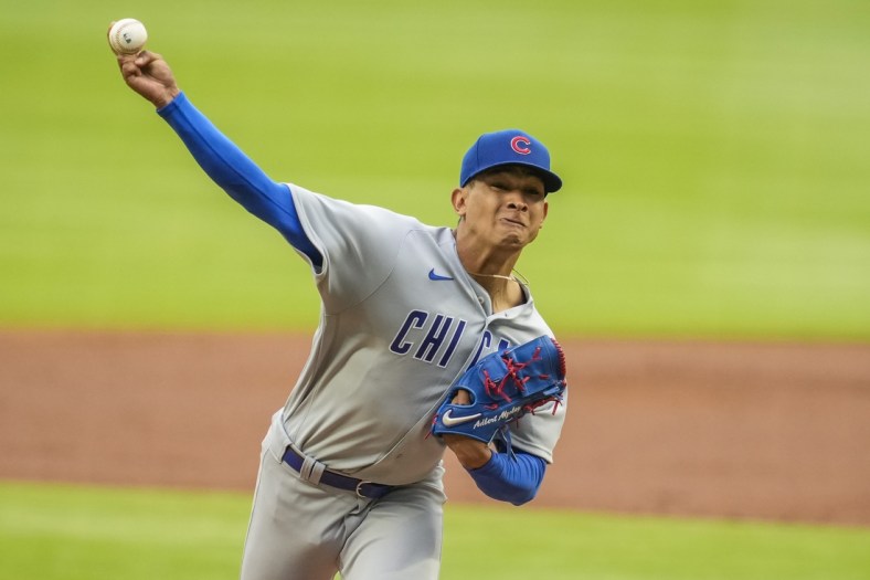 Apr 29, 2021; Cumberland, Georgia, USA; Chicago Cubs starting pitcher Adbert Alzolay (73) pitches against the Atlanta Braves during the first inning at Truist Park. Mandatory Credit: Dale Zanine-USA TODAY Sports