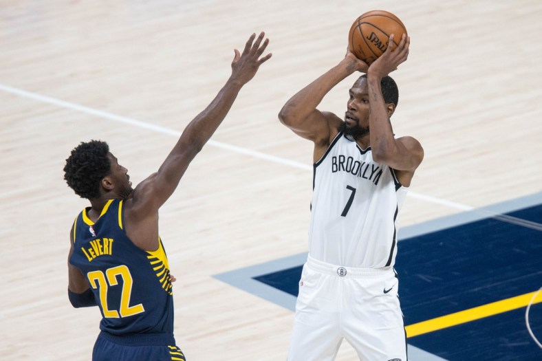 Apr 29, 2021; Indianapolis, Indiana, USA; Brooklyn Nets forward Kevin Durant (7) shoots the ball while Indiana Pacers guard Caris LeVert (22) defends in the third quarter at Bankers Life Fieldhouse. Mandatory Credit: Trevor Ruszkowski-USA TODAY Sports