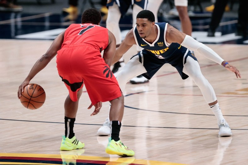 Apr 29, 2021; Denver, Colorado, USA; Toronto Raptors guard Kyle Lowry (7) controls the ball as Denver Nuggets guard Shaquille Harrison (3) guards in the first quarter at Ball Arena. Mandatory Credit: Isaiah J. Downing-USA TODAY Sports