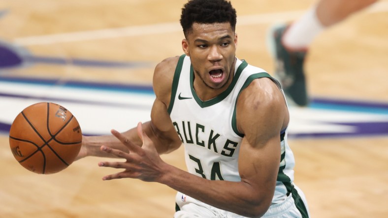 Apr 27, 2021; Charlotte, North Carolina, USA; Milwaukee Bucks forward Giannis Antetokounmpo (34) runs the offense against the Charlotte Hornets in the second half at Spectrum Center. The Milwaukee Bucks won 114-104. Mandatory Credit: Nell Redmond-USA TODAY Sports