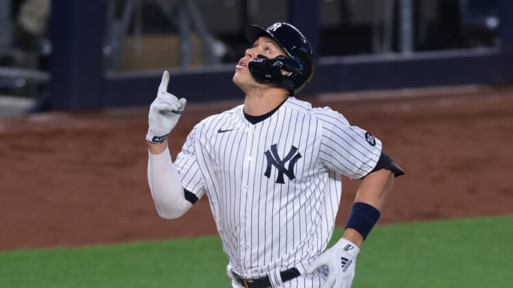 Apr 30, 2021; Bronx, New York, USA; New York Yankees right fielder Aaron Judge (99) celebrates after hitting a home run during the third inning against the Detroit Tigers at Yankee Stadium. Mandatory Credit: Vincent Carchietta-USA TODAY Sports