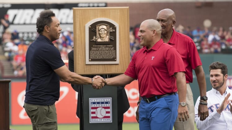 Aug 12, 2017; Arlington, TX, USA; Baseball Hall of Fame members Hall of Fame members Roberto Alomar and Fergie Jenkins unveil Ivan Rodriguez's plaque before the game between the Texas Rangers and the Houston Astros at Globe Life Park in Arlington. Mandatory Credit: Jerome Miron-USA TODAY Sports