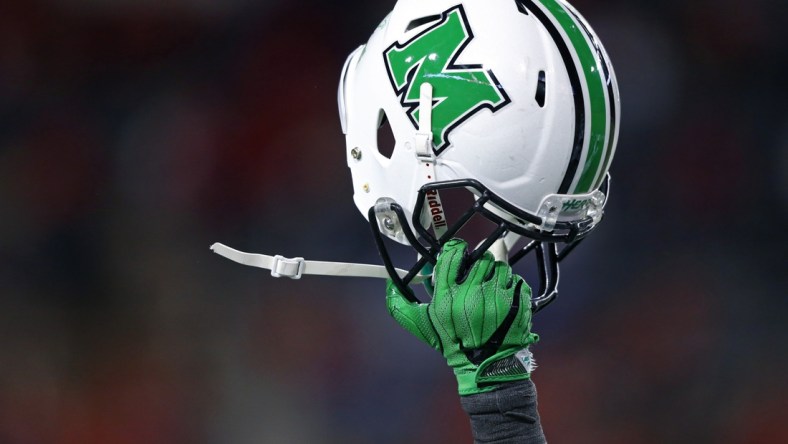 Sep 30, 2017; Cincinnati, OH, USA; A player of the Marshall Thundering Herd holds his helmet to celebrate the touchdown by tight end Ryan Yurachek (not pictured) against the Cincinnati Bearcats in the second half at Nippert Stadium. Mandatory Credit: Aaron Doster-USA TODAY Sports