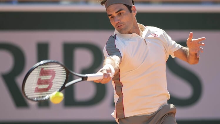 Jun 7, 2019; Paris, France: Roger Federer (SUI) in action during his match against Rafael Nadal (ESP) on day 13 of the 2019 French Open at Stade Roland Garros. Mandatory Credit: Susan Mullane-USA TODAY Sports