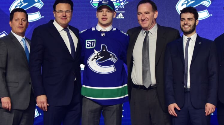 Jun 21, 2019; Vancouver, BC, Canada; Vasily Podkolzin poses for a photo after being selected as the number ten overall pick to the Vancouver Canucks in the first round of the 2019 NHL Draft at Rogers Arena. Mandatory Credit: Anne-Marie Sorvin-USA TODAY Sports