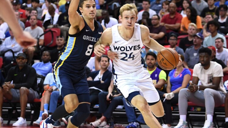 Jul 15, 2019; Las Vegas, NV, USA; Minnesota Timberwolves guard Canyon Barry (24) dribbles the ball against Memphis Grizzlies guard Dusty Hannahs (8) during the second half of the NBA Summer League championship game at Thomas & Mack Center. Mandatory Credit: Stephen R. Sylvanie-USA TODAY Sports