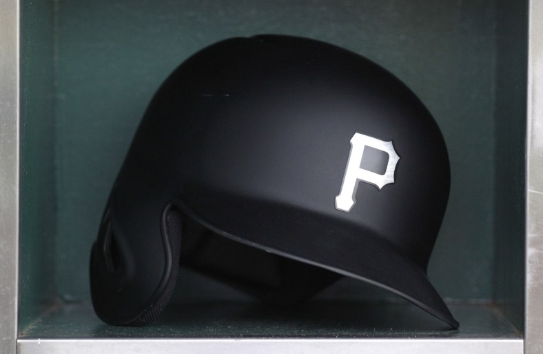 Aug 23, 2019; Pittsburgh, PA, USA;  A Pittsburgh Pirates batting helmet sits in in the dugout before the game against the Cincinnati Reds during an MLB Players' Weekend game at PNC Park. Mandatory Credit: Charles LeClaire-USA TODAY Sports