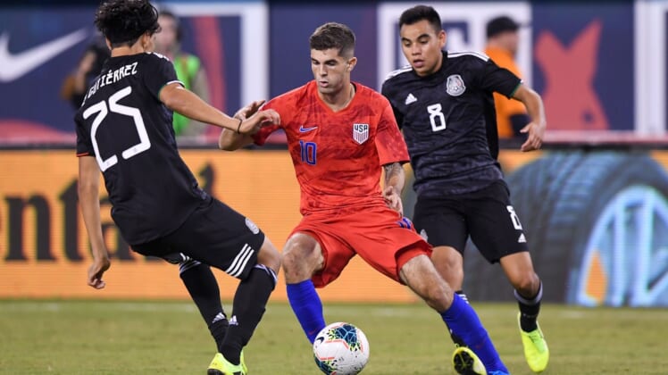 Sep 6, 2019; East Rutherford, NJ, USA; United States midfielder Christian Pulisic (10) drives the ball against Mexico midfielder Erick Guti rrez (25) during the second half during an international friendly soccer match at MetLife Stadium. Mandatory Credit: Dennis Schneidler-USA TODAY Sports
