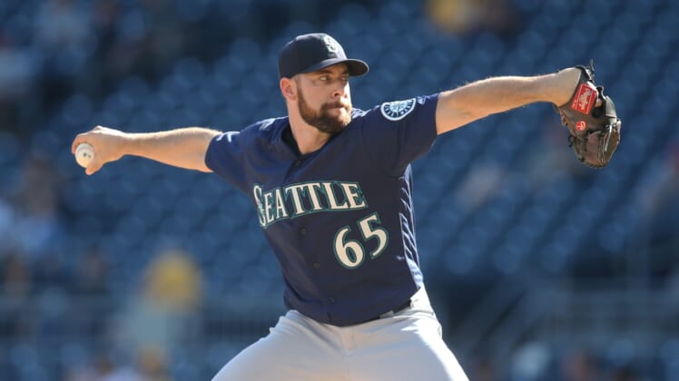 Sep 19, 2019; Pittsburgh, PA, USA;  Seattle Mariners relief pitcher Brandon Brennan (65) pitches against the Pittsburgh Pirates during the tenth inning The Mariners won 6-5 in eleven innings. at PNC Park. Mandatory Credit: Charles LeClaire-USA TODAY Sports
