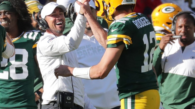 Green Bay Packers quarterback Aaron Rodgers (12) celebrates his 74-yard touchdown pass to Marquez Valdes-Scantling with Green Bay Packers head coach Matt LaFleur during the 4th quarter of the Green Bay Packers 42-24 win over the Oakland Raiders at Lambeau Field in Green Bay  on Sunday, Oct. 20, 2019.  Photo by Mike De Sisti/Milwaukee Journal Sentinel

Packers21 4373