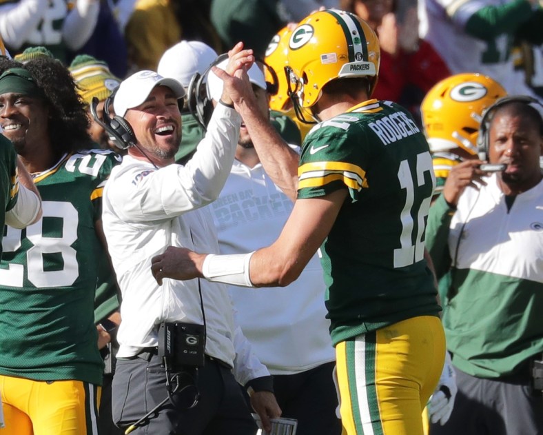 Green Bay Packers quarterback Aaron Rodgers (12) celebrates his 74-yard touchdown pass to Marquez Valdes-Scantling with Green Bay Packers head coach Matt LaFleur during the 4th quarter of the Green Bay Packers 42-24 win over the Oakland Raiders at Lambeau Field in Green Bay  on Sunday, Oct. 20, 2019.  Photo by Mike De Sisti/Milwaukee Journal Sentinel

Packers21 4373