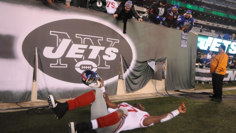 Giants' Brandon Jacobs pretends to crash while flying into the locker room after their win over the Jets at MetLife Stadium.

0000jacobs24164e56 00006