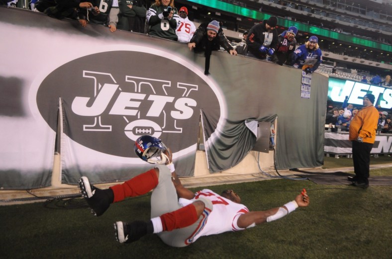 Giants' Brandon Jacobs pretends to crash while flying into the locker room after their win over the Jets at MetLife Stadium.

0000jacobs24164e56 00006