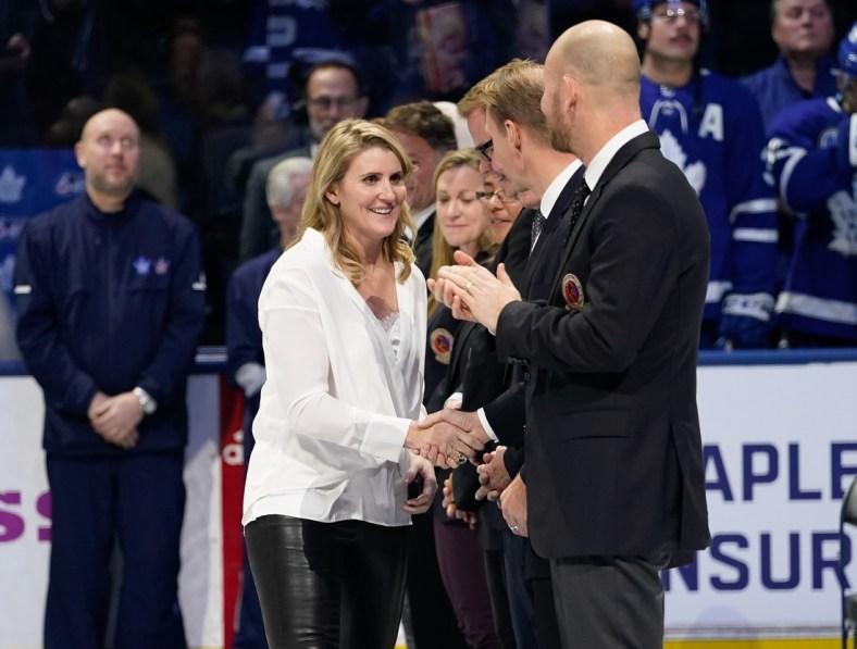 Nov 15, 2019; Toronto, Ontario, CAN; Class of 2019 Hockey Hall of Fame inductee Hayley Wickenheiser shakes hands with hall of famers prior to a game between the Boston Bruins and Toronto Maple Leafs at Scotiabank Arena. Mandatory Credit: John E. Sokolowski-USA TODAY Sports