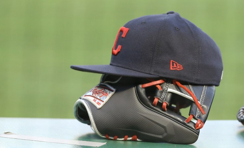 Aug 19, 2020; Pittsburgh, Pennsylvania, USA;  Cleveland Indians hats and glove on the dugout rail against the Pittsburgh Pirates during the third inning at PNC Park. The Indians won 6-1. Mandatory Credit: Charles LeClaire-USA TODAY Sports