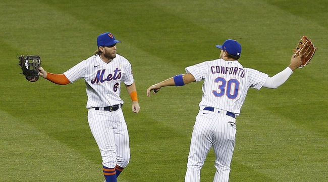 Sep 5, 2020; New York City, New York, USA; New York Mets left fielder Jeff McNeil (6) and right fielder Michael Conforto (30) react after defeating the Philadelphia Phillies at Citi Field. Mandatory Credit: Andy Marlin-USA TODAY Sports