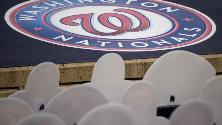 Sep 11, 2020; Washington, District of Columbia, USA; A Washington Nationals logo is seen in front of cutouts of fans in the seats during the third inning of the game between the Washington Nationals and the Atlanta Braves at Nationals Park. Mandatory Credit: Scott Taetsch-USA TODAY Sports