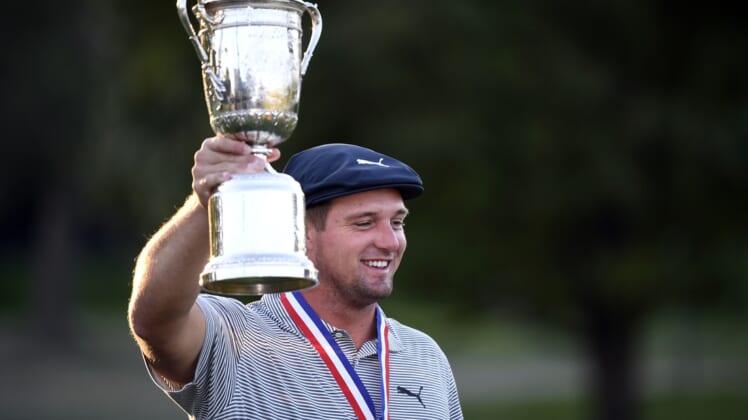 Sep 20, 2020; Mamaroneck, New York, USA; Bryson DeChambeau poses and celebrates with the trophy after winning the U.S. Open golf tournament at Winged Foot Golf Club - West. Mandatory Credit: Danielle Parhizkaran-USA TODAY Sports