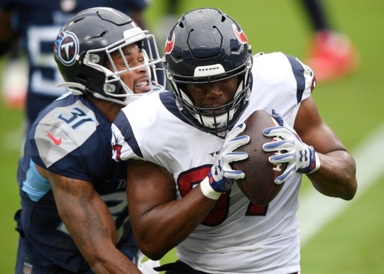 Houston Texans tight end Darren Fells (87) hauls in a touchdown pass defended by Tennessee Titans free safety Kevin Byard (31) during the second quarter at Nissan Stadium Sunday, Oct. 18, 2020 in Nashville, Tenn.

An52857