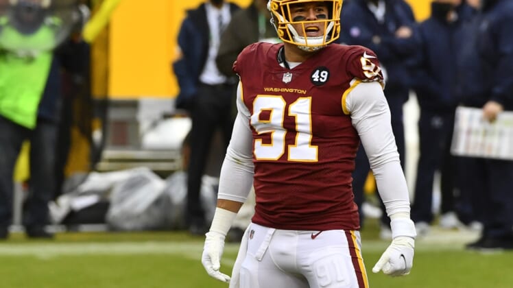 Oct 25, 2020; Landover, Maryland, USA; Washington Football Team defensive end Ryan Kerrigan (91) reacts after recording a sack against the Dallas Cowboys during the second half at FedExField. Mandatory Credit: Brad Mills-USA TODAY Sports