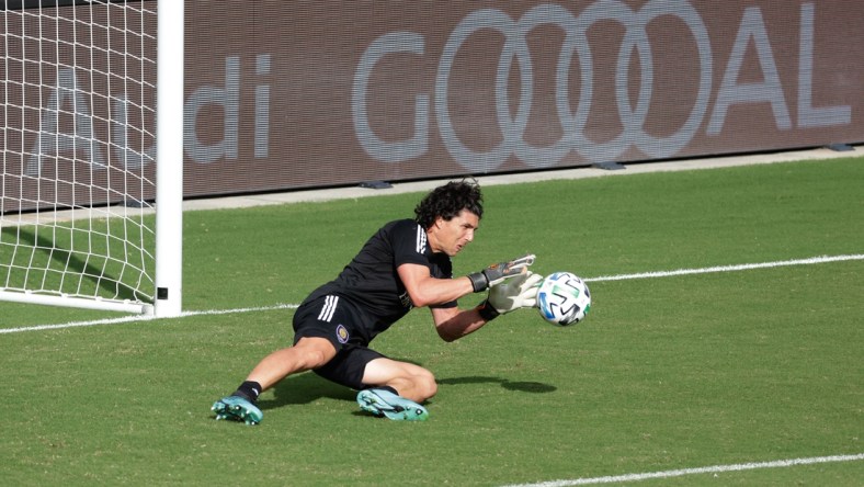 Nov 29, 2020; Orlando, Florida, USA;  Orlando City SC goal keeper Brian Rowe (23) warms up against the New England Revolution at Orlando City Stadium. Mandatory Credit: Rhona Wise-USA TODAY Sports