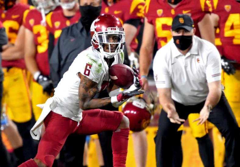 Dec 6, 2020; Los Angeles, California, USA;     Washington State Cougars wide receiver Jamire Calvin (6) catches a pass for a first down in the second half of the game against the USC Trojans at United Airlines Field at the Los Angeles Memorial Coliseum. Mandatory Credit: Jayne Kamin-Oncea-USA TODAY Sports