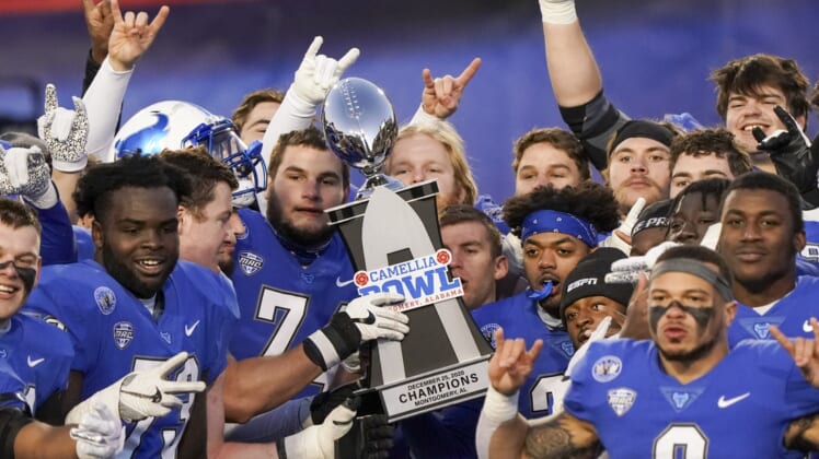 Dec 25, 2020; Montgomery, AL, USA; Buffalo Bulls hoist the trophy after winning the Camellia Bowl against Marshall Thundering Herd during the second half at Cramton Bowl Stadium. Mandatory Credit: Marvin Gentry-USA TODAY Sports