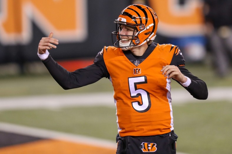 Dec 21, 2020; Cincinnati, Ohio, USA; Cincinnati Bengals quarterback Ryan Finley (5) reacts after scoring a touchdown in the second half against the Pittsburgh Steelers at Paul Brown Stadium. Mandatory Credit: Katie Stratman-USA TODAY Sports