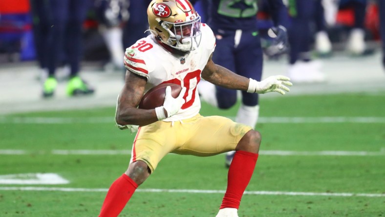 Jan 3, 2021; Glendale, Arizona, USA; San Francisco 49ers running back Jeff Wilson Jr. (30) against the Seattle Seahawks at State Farm Stadium. Mandatory Credit: Mark J. Rebilas-USA TODAY Sports