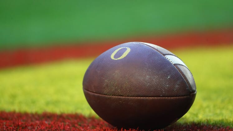 Jan 2, 2021; Glendale, AZ, USA; Detailed view of an Oregon Ducks logo on an official football on the field during the Fiesta Bowl at State Farm Stadium. Mandatory Credit: Mark J. Rebilas-USA TODAY Sports