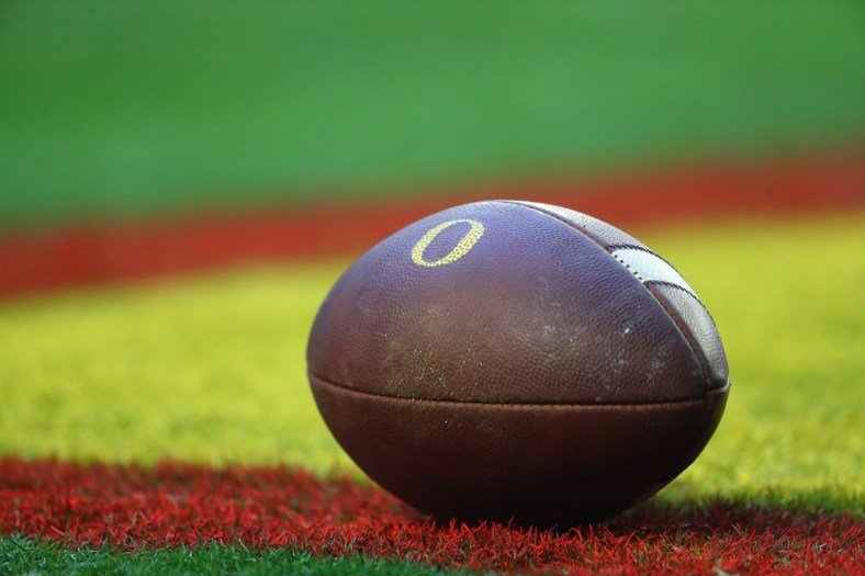 Jan 2, 2021; Glendale, AZ, USA; Detailed view of an Oregon Ducks logo on an official football on the field during the Fiesta Bowl at State Farm Stadium. Mandatory Credit: Mark J. Rebilas-USA TODAY Sports